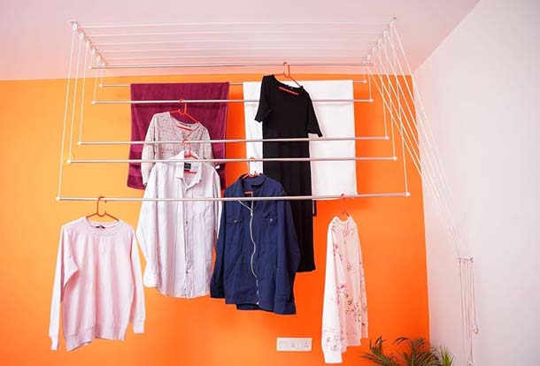 Space-saving ceiling-mounted cloth hangers